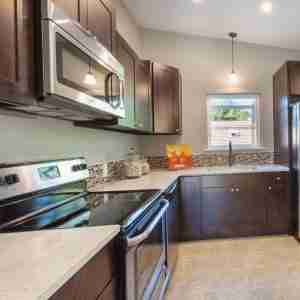 Custom kitchen with vent hood by Holz Industries, Kelowna