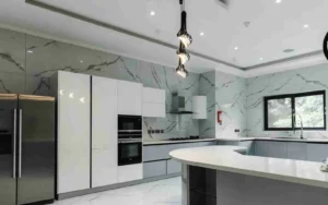 Modern white kitchen with marble backsplash and curved island
