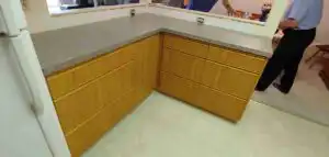 Custom golden oak bathroom vanity with stone countertop